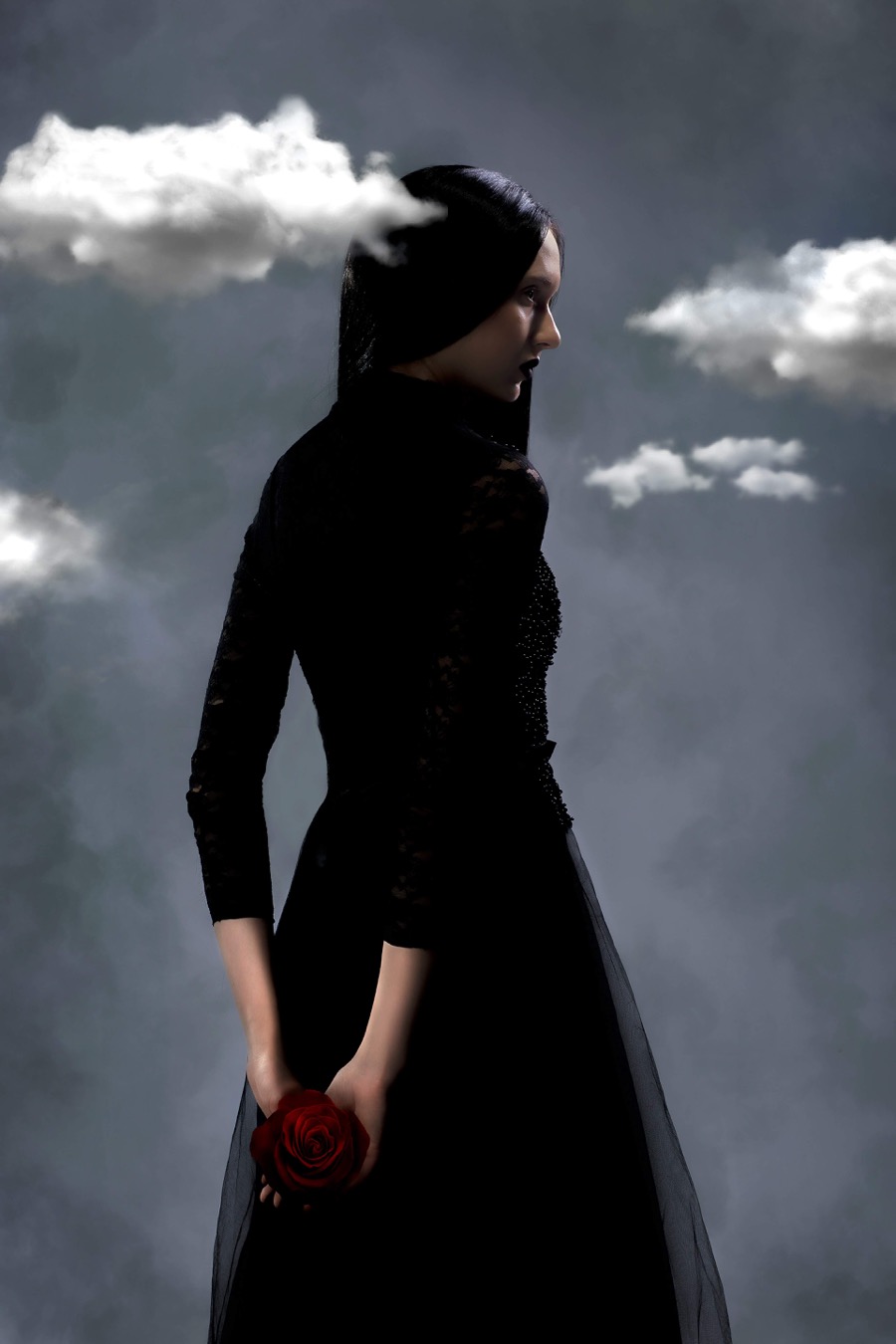 A woman wearing a black dress